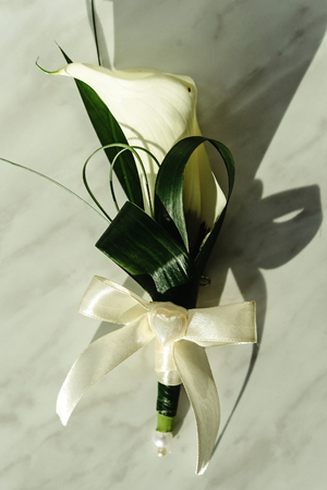 luxury gorgeous wedding boutonniere with white calla and lily for groom