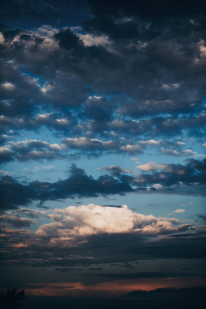 amazing view of sunset sky with clouds, vertical image of sunset or sunrise . beautiful landscape