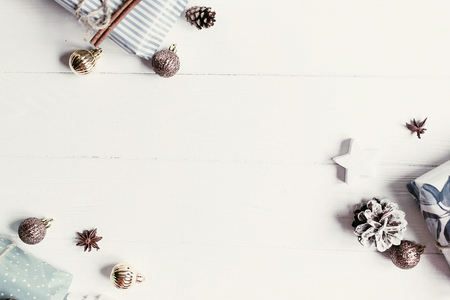 christmas flat lay. modern christmas layout with ornaments and gift boxes, top view with space for text. holiday mockup greeting card. stylish winter flatlayの写真素材
