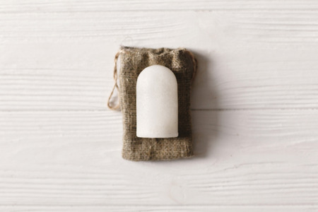 eco natural crystal alunite deodorant flat lay on rustic background. sustainable lifestyle concept. zero waste. plastic free items. stop plastic pollution. reuse, reduce, recycle, refuseの写真素材
