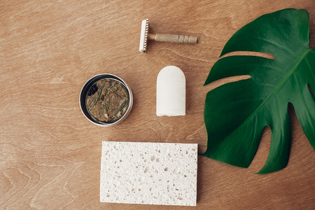Zero waste flat lay. Natural soap, solid shampoo in metal tin, reusable razor, crystal eco...