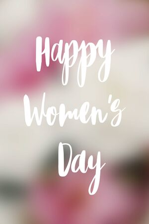 Happy women's day text on beautiful peonies blurred background. Stylish pink and white peony wallpaper, vertical image. Greeting cardの写真素材