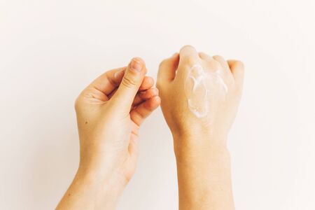 Avoiding dry skin. Hands applying moisturizing cream and massaging skin after washing hands. Treatment for dry skin. Luxury skin care. Hand cream.の写真素材