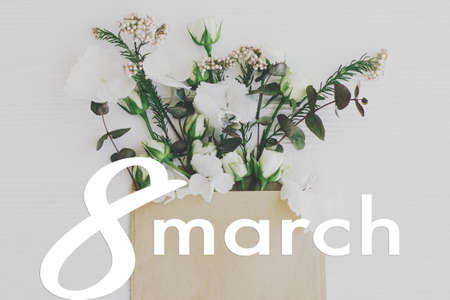 Happy women's day floral greeting card, 8 march text sign on roses, hydrangea and eucalyptus...