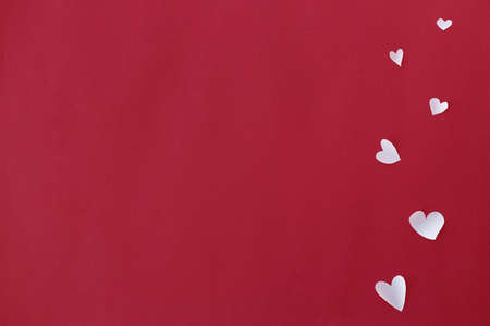 Happy Valentine's Day! Stylish hearts border on red background flat lay with space for text....