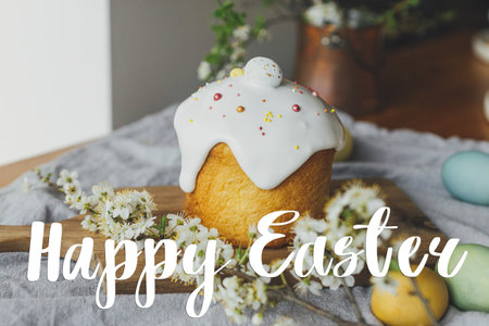 Happy Easter greeting card. Happy Easter text and stylish easter bread, natural dyed eggs and spring...