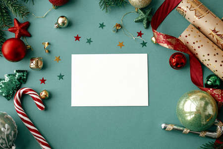 Christmas card flat lay. Modern greeting card mock up with stylish christmas decorations and...
