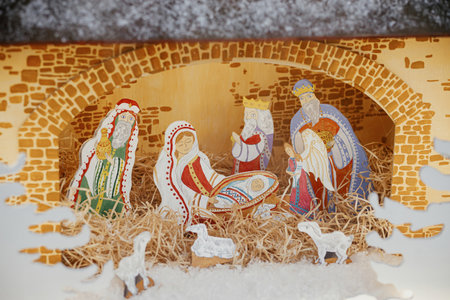 Nativity scene. Holy night scene with saint figurines and baby Jesus in creche.Christmas decor in city street. Winter holidays in Europe. Merry Christmasの写真素材