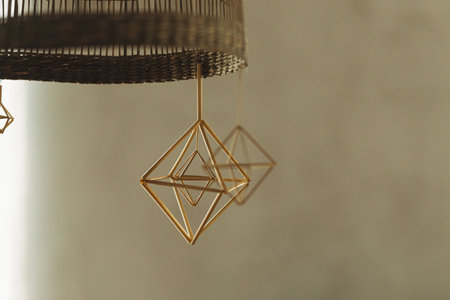 Rustic scandinavian straw decoration hanging on background modern farmhouse living room. Decorating home with christmas straw spiders. Holiday traditionsの写真素材