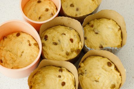 Baking easter traditional bread. Raw dough in baking forms for making homemade easter cake. Orthodox traditional food paskaの写真素材
