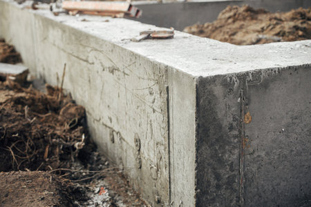 Concrete foundation with reinforcement close up. Construction site, process of house building. Formwork for foundation. New housing constructionの写真素材
