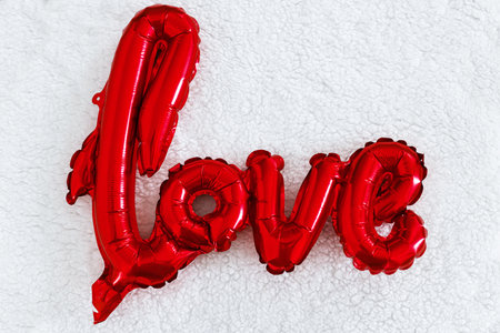 Love flat lay. Happy valentines day. Stylish love word balloon soft white background. Love backgroundの写真素材
