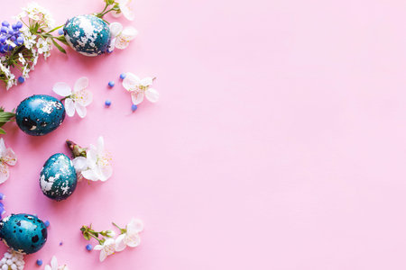 Easter flat lay. Stylish easter eggs and cherry flowers on pink background. Easter celebration,...