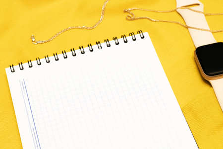 White checkered paper and smart watch, flat lay. business and financeの写真素材