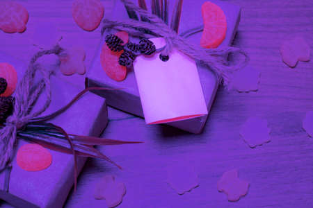 gift boxes decorated with sweets on a purple background. Holiday conceptの写真素材