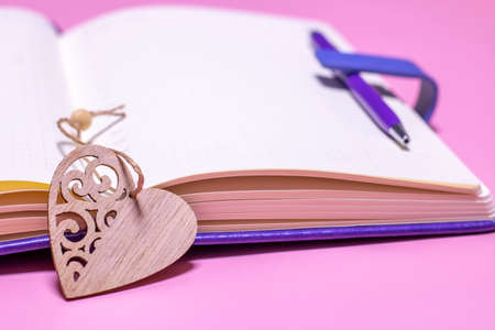A personal diary for a girl with secrets about love and a heart bookmark. Notes about love, congratulations.の写真素材