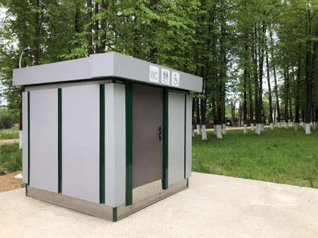 Modern toilet module, toilet cabin for the disabled, women's and men's toilets in the park.