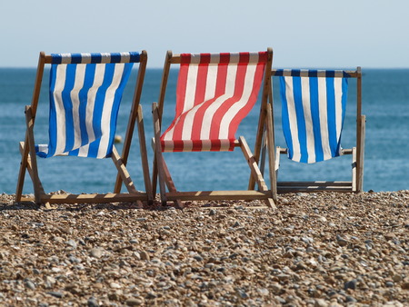 deckchair on the beach in brighton in the summer breeze, UK