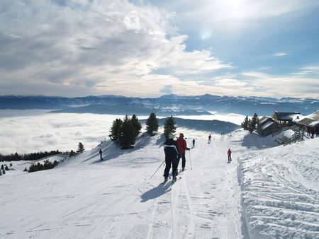 Skier on a mountain, directionally rotating snowfallのeditorial素材