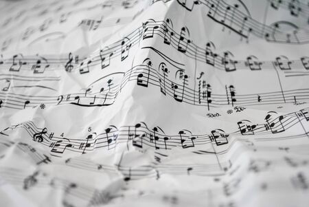 Portable and musical score with distinct musical notesの写真素材