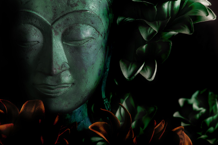 The serene face of Buddha in peaceful meditation. Many connotations of spiritual enlightenment. Peace, love and Zen.の写真素材