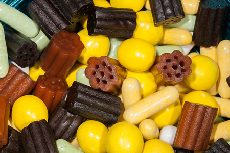 Close up of sweet confectionery. Multi-colored soft liquorice candy pieces background image.の写真素材