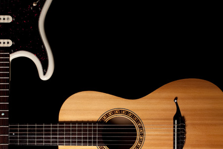 Guitars music image with copy-space. Crossed electric and acoustic guitar corner graphic against...