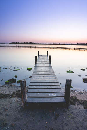 Beautiful sunset with a colorful sky. Grote Piet Zeeland, The Netherlandsの写真素材