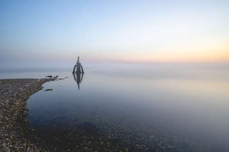 Misty morning at the coast, Den Osse Zealand, The Netherlands.の写真素材