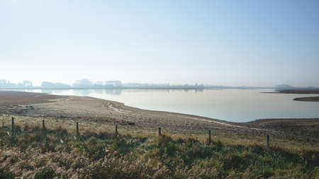 misty early morning in Zeeland The Netherlandsの写真素材