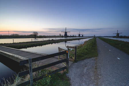 Sunrise behind the wind miles in Kinderdijk The Netherlands. Apr 17 2021のeditorial素材
