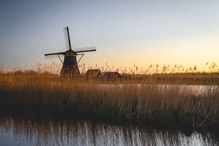 Sunrise behind the wind miles in Kinderdijk The Netherlands. Apr 17 2021のeditorial素材
