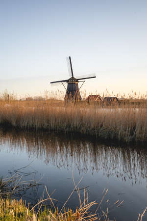 Sunrise behind the wind miles in Kinderdijk The Netherlands. Apr 17 2021のeditorial素材