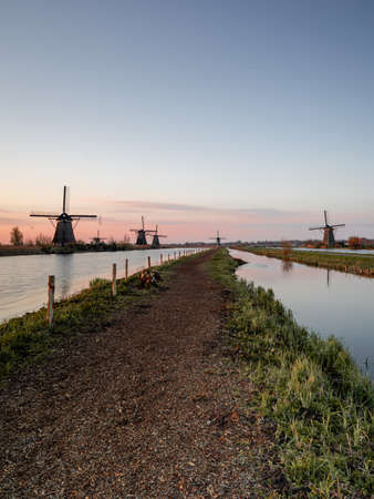 Sunrise behind the wind miles in Kinderdijk The Netherlands. Apr 17 2021のeditorial素材