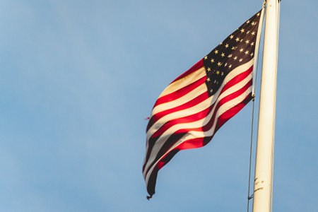 American flag waving in the wind, at the American cemetery at Magraten in The Netherlands.