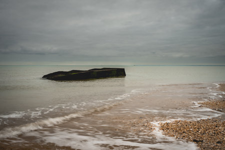 Old shipwreck from world war Two, at the coast of Utah Beach, France.の写真素材