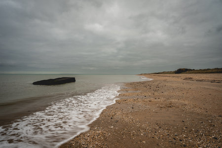 Old shipwreck from world war Two, at the coast of Utah Beach, France.の写真素材