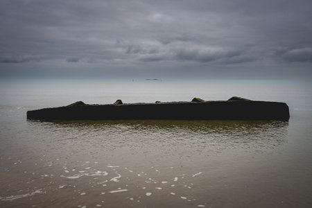 Old shipwreck from world war Two, at the coast of Utah Beach, France.の写真素材