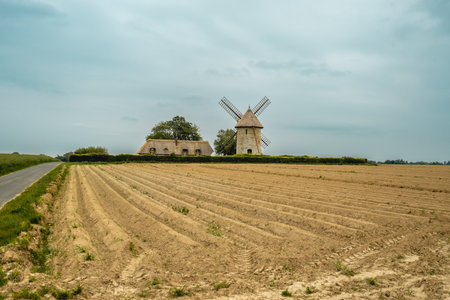 Moulin de pierre, old windmill in Hauville, France.の写真素材