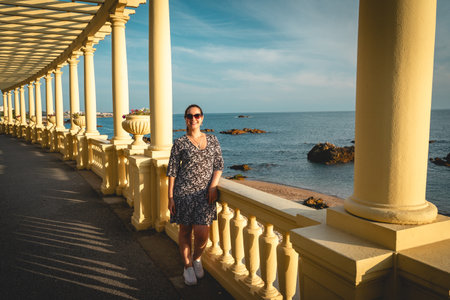 Woman posing on the boulevard in Porto, Portugal.の写真素材