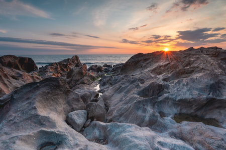 Sunset at the rocky beach at Vila Nova de Gaia, Portugal.の写真素材