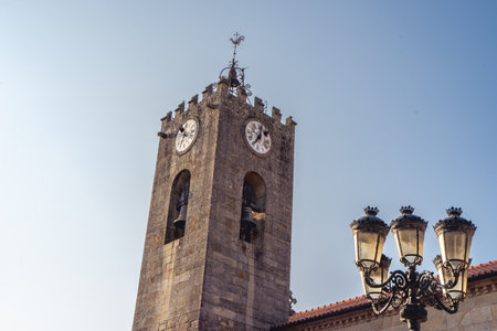 Old church and streetlight, in the Center of Ponte de Lima, Portugal.の写真素材