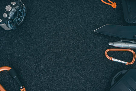 Set of climbing equipment on black background. Top view. Copy space.