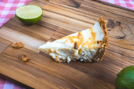 A home made Lemon pie, on a wooden plate. Decorated with lemons.の写真素材