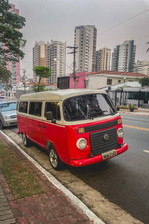 SÃ£o Paulo, SP Brazil, August 23, 2024. An old Volkswagen Transporter in white and red. Parked on the side in the streets of SÃ£o Paulo, Brazil,の写真素材