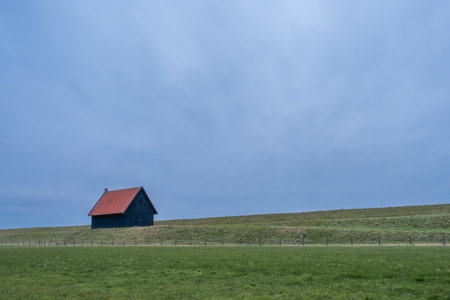 Old barn at the coast of Wieringerwerf, The Netherlands.の写真素材