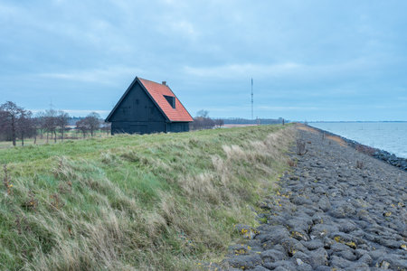 Old barn at the coast of Wieringerwerf, The Netherlands.の写真素材