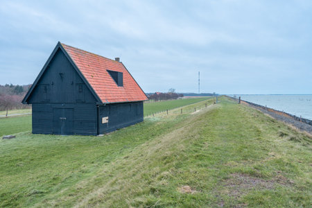 Old barn at the coast of Wieringerwerf, The Netherlands.の写真素材