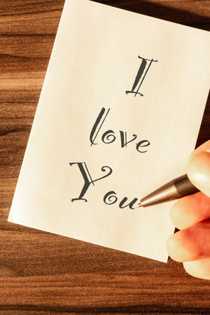 A Love you note on a wooden background.の写真素材