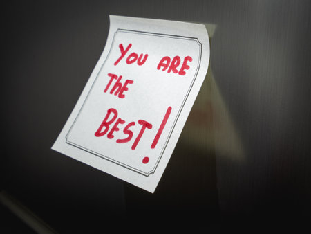 A positive message on a sticky note, Hanging on the fridge.の写真素材